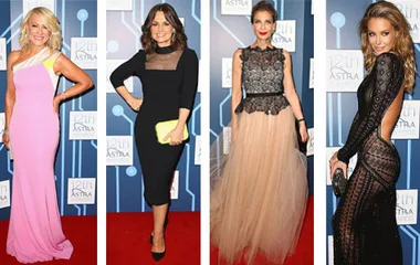 Guests at the Astra Awards wearing elegant evening gowns, each with distinct colors and styles on the red carpet.
