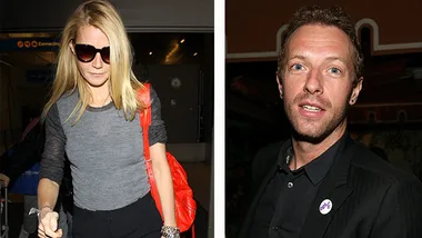 Two individuals side by side; one wearing sunglasses and holding a red bag, the other in a black suit with a pin.