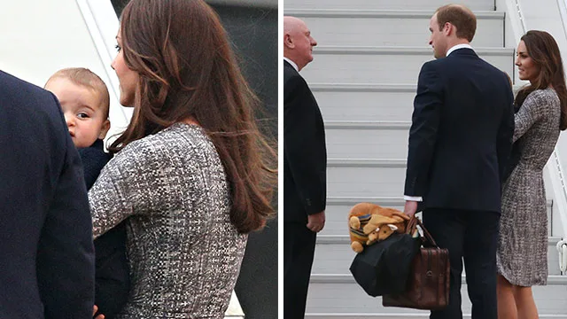 A couple in formal wear with a baby and luggage, boarding a plane; an official greets them on the stairs.