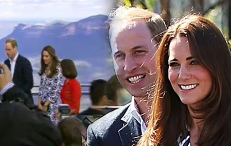 Meeting a crowd with a mountain backdrop, smiling.