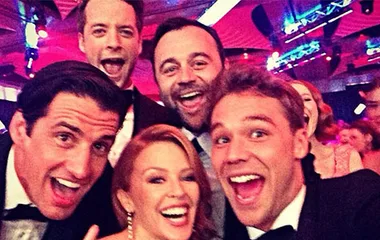 Group selfie at the Logies with five people smiling warmly at the camera in a lively, colorful event setting.