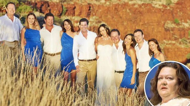 Group photo of people in blue and white attire with a woman inset, in an outdoor setting with red cliffs in the background.