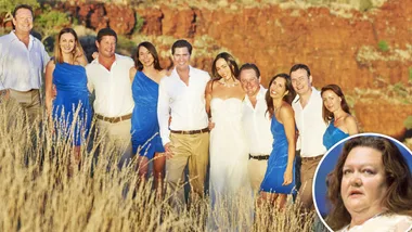 Group photo of people in blue and white attire with a woman inset, in an outdoor setting with red cliffs in the background.