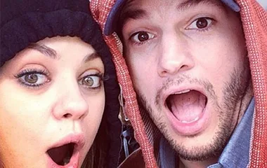 Two people wearing hoodies with surprised expressions.
