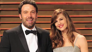 Ben Affleck and Jennifer Garner smiling together at an event, dressed in formal attire.