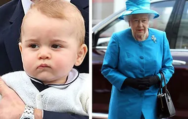 Royal baby held in arms beside elegantly dressed older woman in blue coat and hat.
