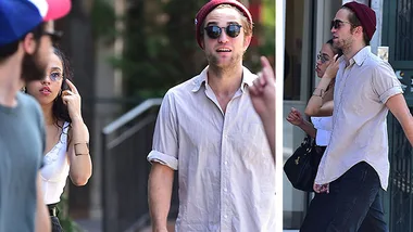 Robert Pattinson and FKA Twigs walking outside, with Pattinson wearing a beanie and sunglasses.