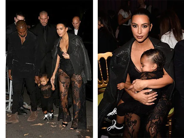 A couple with their child, wearing black outfits. The woman is holding the child on her lap in the second image.