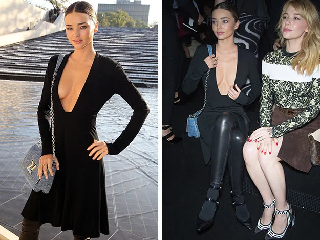 Person in a black dress with a plunging neckline, holding a small purse, outdoors and seated indoors at an event.