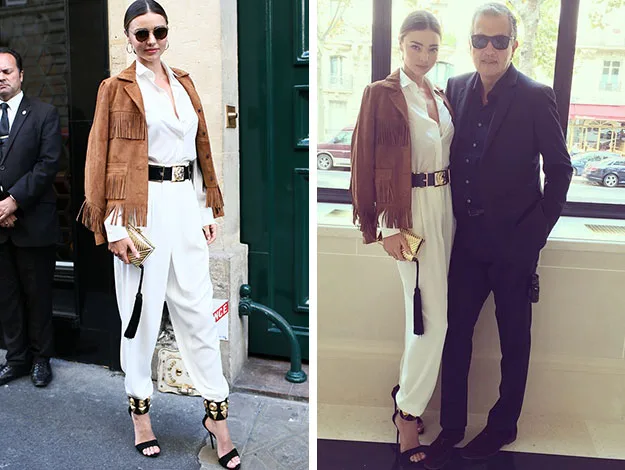 "Person in white outfit with brown fringe jacket and sunglasses, posing outside and indoors with another individual."