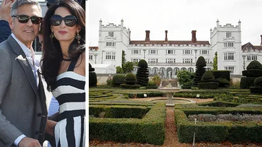 Couple in formal attire at a grand estate garden with a historic building in the background.