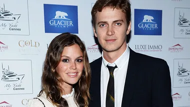 Rachel Bilson and Hayden Christensen at an event, standing together, smiling.