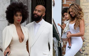 Solange in a white dress with her groom, and a woman holds a child in white attire, at an elegant wedding event.