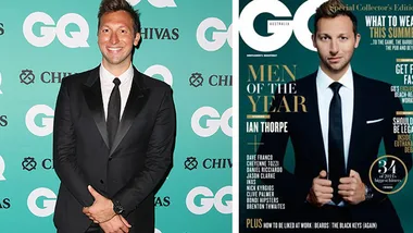 Ian Thorpe in a suit at a GQ event, next to his GQ Men of the Year magazine cover.