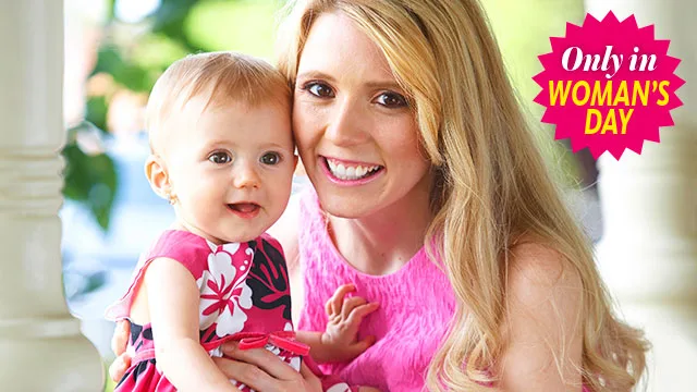 A woman and a baby smiling together, both in pink outfits, with a "Only in Woman's Day" badge.