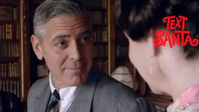 Man in a suit talking to a woman, with "Text Santa" logo in the corner, set in a vintage room with bookshelves.