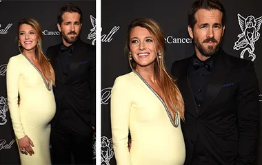 A smiling couple poses at a formal event, the woman in a yellow dress showing a baby bump, while the man wears a dark suit.