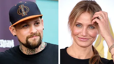 Man in a cap with tattoos and a woman smiling while touching her hair.