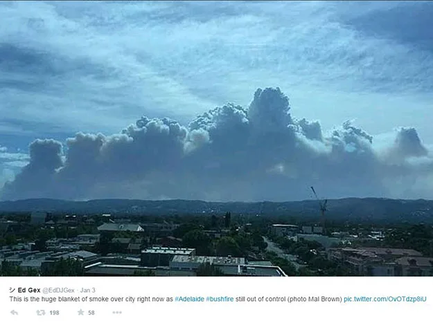 Bushfire smoke sky over Adelaide, with clouds rising above the cityscape in the foreground.