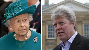 Senior royal figure in teal outfit alongside a man in a suit, outside a stately building.