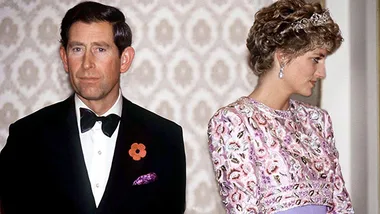 Couple in formal attire, standing apart; man in tuxedo, woman in floral dress with tiara, looking away.