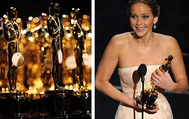 Oscars statuettes on left; person holding Oscar on right, smiling at the podium.