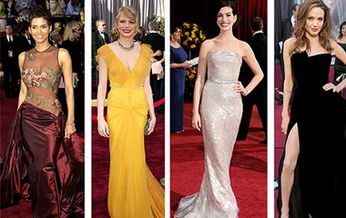 Four women on the red carpet in elegant gowns at the Oscars, showcasing different styles and colors.