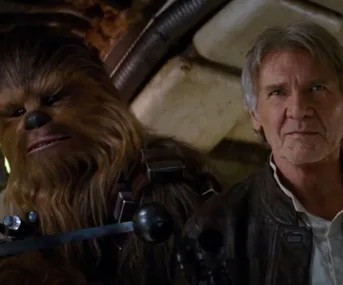 Han Solo and Chewbacca in the Millennium Falcon cockpit from Star Wars trailer.