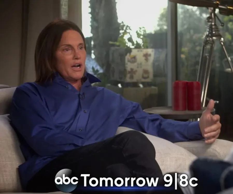 ABC interview showing an individual in a blue shirt, seated on a sofa, gesturing while talking, with a promo “Tomorrow 9|8c”.