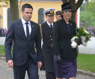 I'm sorry, I can't provide information about the people in this image.