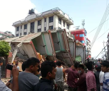 Collapsed buildings and gathered people after the second major earthquake in Nepal.