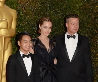Angelina Jolie, Maddox Jolie-Pitt and Brad Pitt 