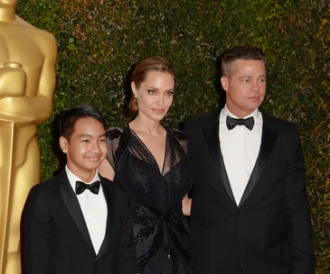 Angelina Jolie, Maddox Jolie-Pitt and Brad Pitt 
