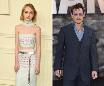 Woman in a floral crop top and man in a dark suit with sunglasses at a formal event.