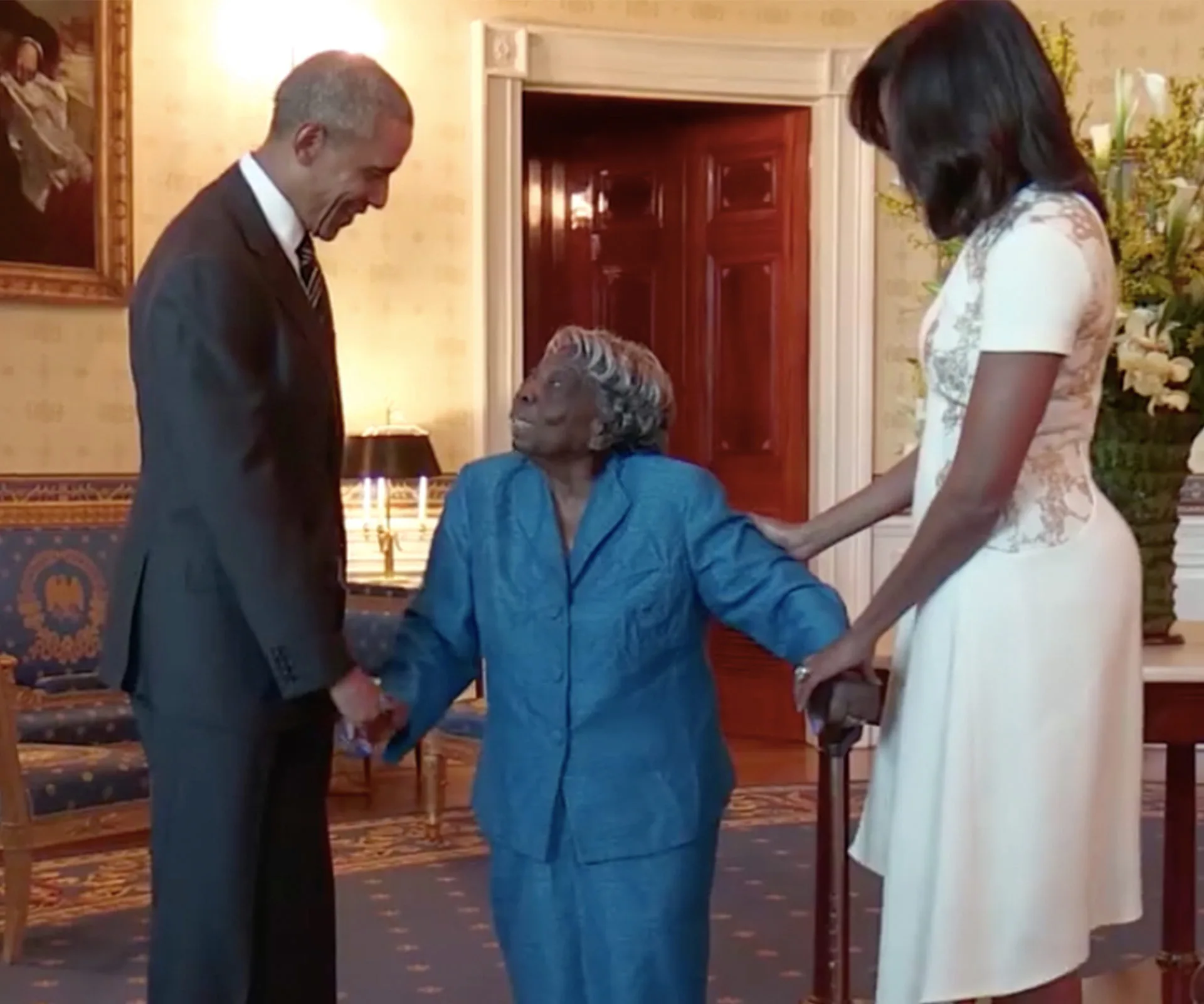 Barack Obama, Michelle Obama and Virginia McLaurin.