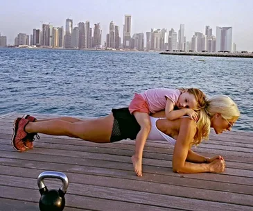 Instagram fit mum uses her kids as weights