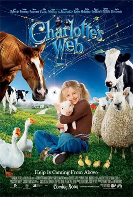 Young girl holding piglet surrounded by farm animals and a blue sky. "Charlotte's Web" title with web background.