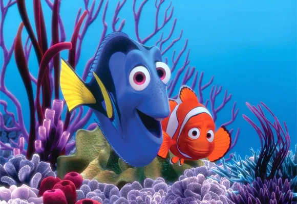 Dory and Marlin, characters from "Finding Nemo," swim among colorful coral in a vibrant underwater scene.