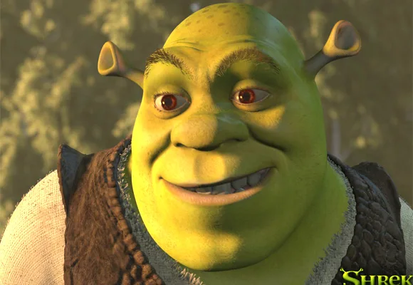 Shrek the ogre smiling in a forest setting, from the animated movie series "Shrek".