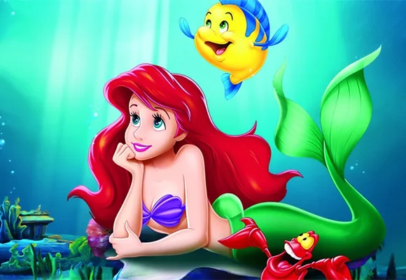 Ariel the mermaid with Flounder and Sebastian underwater, from Disney's "The Little Mermaid."
