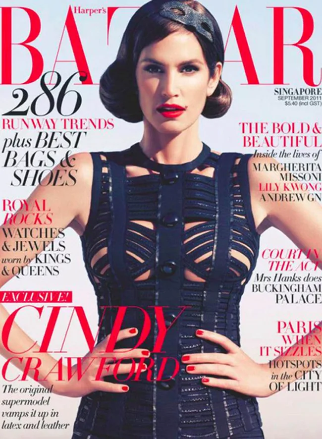 Cover of Harper's Bazaar featuring a model in a black dress, with bold red lipstick and styled hair.