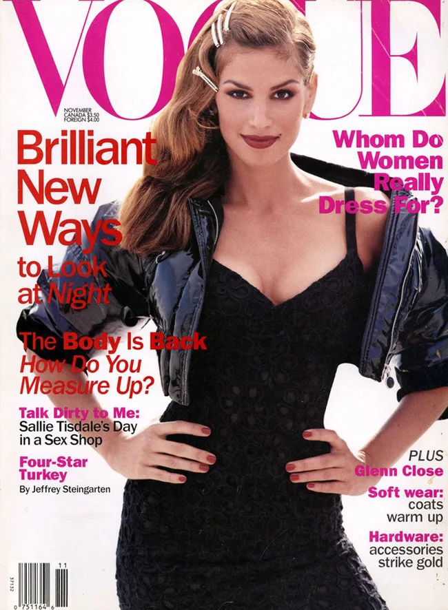 Vogue magazine cover featuring a woman in a black lace dress and jacket, with bold fashion headlines, November issue.