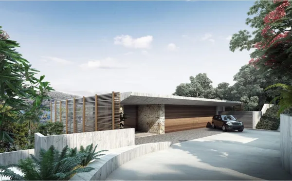 Modern house with stone and wood facade, surrounded by trees, with a driveway and car in front.
