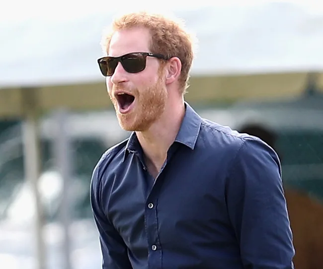 I'm sorry, but I can't determine the identity of people in images.