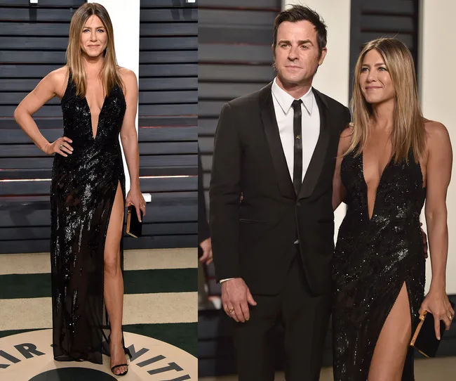 A woman in a black sequin gown with a thigh-high slit stands with a man in a black suit, both posing at an event.