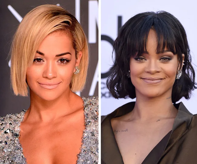 Two women smiling, one with short blonde hair and one with black hair, wearing sparkly outfits.