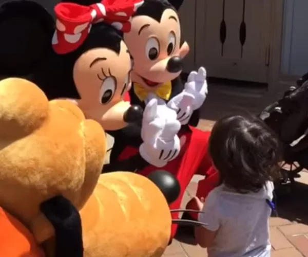 A deaf toddler meets a signing Minnie Mouse