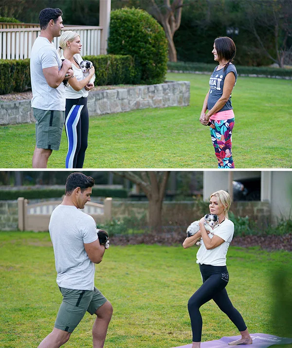 Three people with a puppy in a garden, practicing yoga poses on grass.