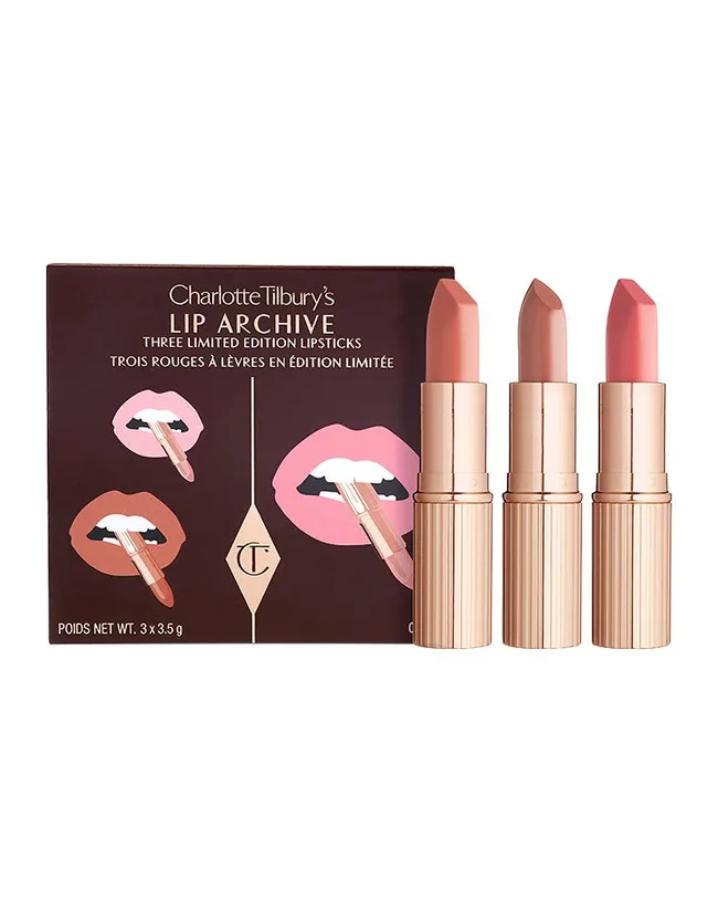 Charlotte Tilbury Lip Archive set with three nude-colored lipsticks in gold tubes next to the product box.