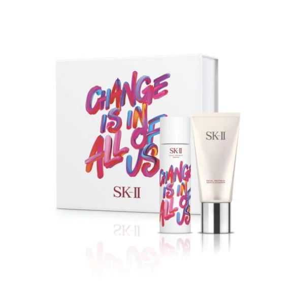 SK-II skincare set with colorful packaging reading "Change is in all of us" on a white background.